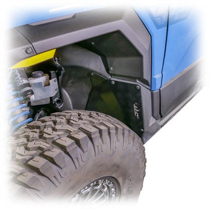 Three quarter view showing fitted inner fender guards on Xpedition