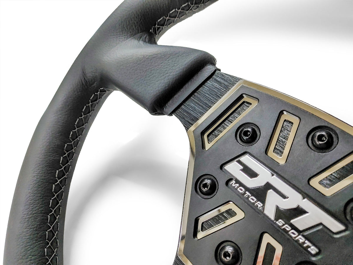 Details of a Round utv steering wheel in leather finish