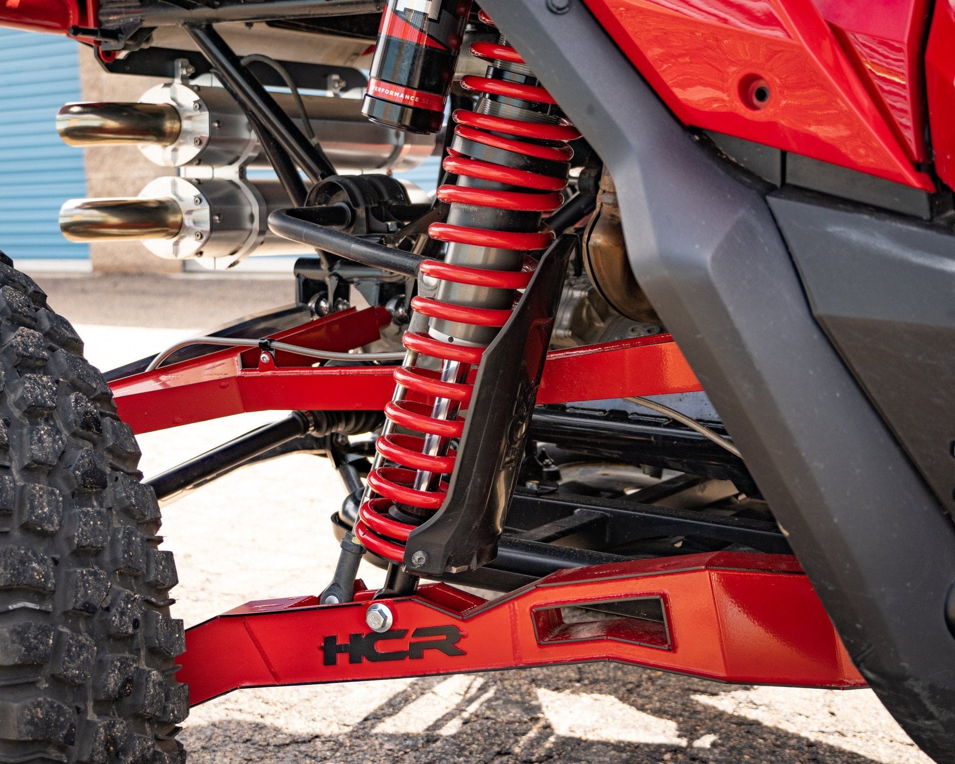 HCR RACING TAL-05400 HONDA TALON 1000R LONG TRAVEL SUSPENSION KIT close-up of red suspension components