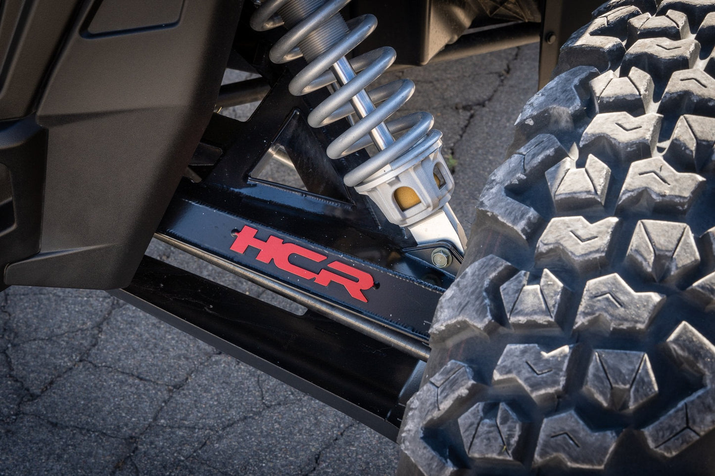 HCR Racing RZR-05700 Polaris RZR XP 1000 Dual-Sport Mid-Travel Suspension Kit close-up view of suspension system and tire.