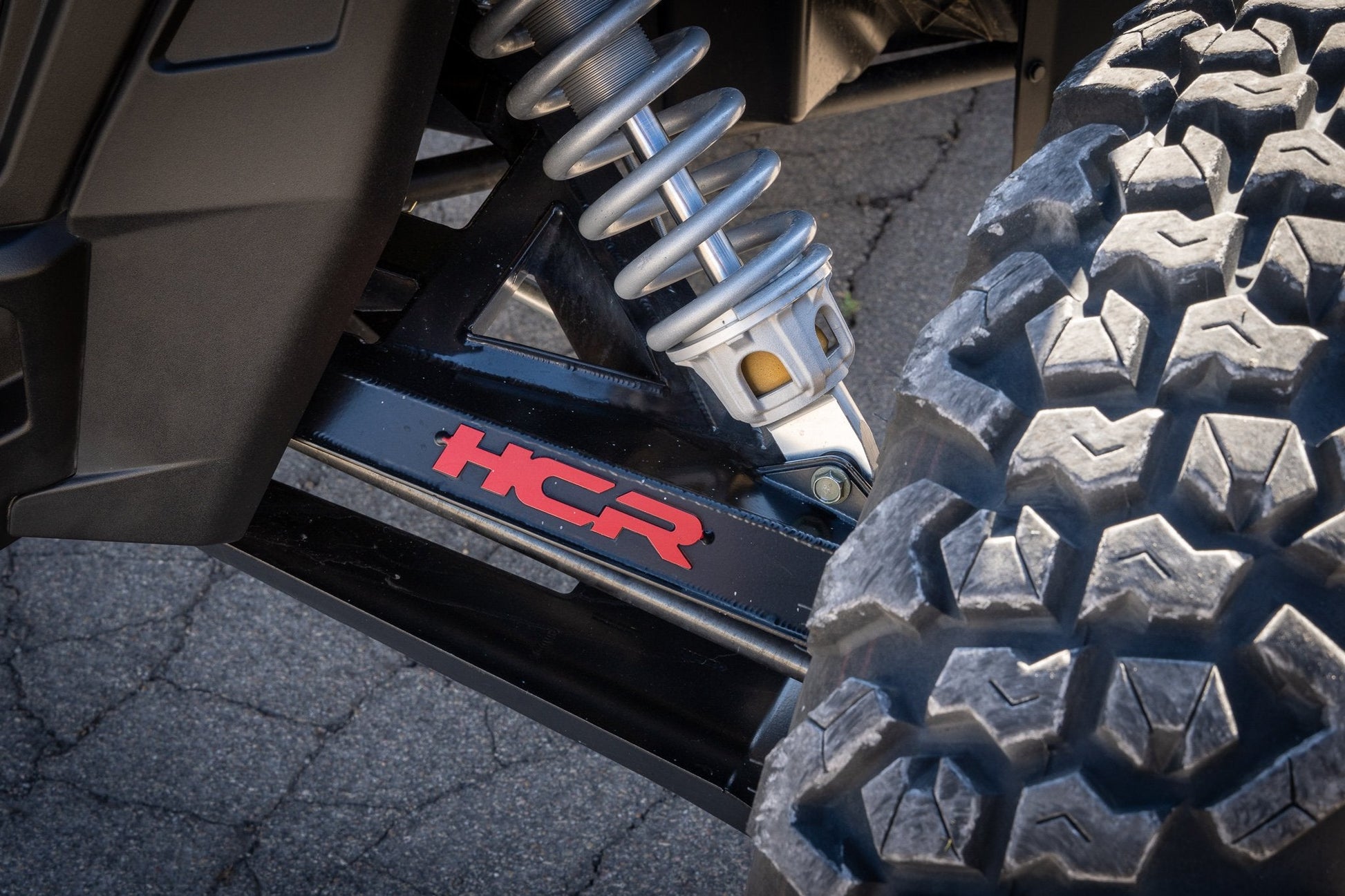 HCR Racing RZR-05700 Polaris RZR XP 1000 Dual-Sport Mid-Travel Suspension Kit close-up view of suspension system and tire.