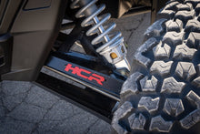 HCR Racing RZR-05700 Polaris RZR XP 1000 Dual-Sport Mid-Travel Suspension Kit close-up view of suspension system and tire.