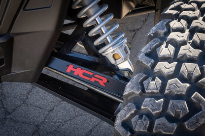 HCR Racing RZR-05700 Polaris RZR XP 1000 Dual-Sport Mid-Travel Suspension Kit close-up view of suspension system and tire.