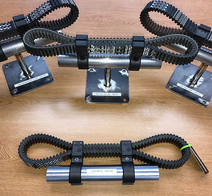 UTV SPARE BELT MOUNT BY DT RACING displayed on a wooden surface to hold spare belts for UTVs and ATVs.